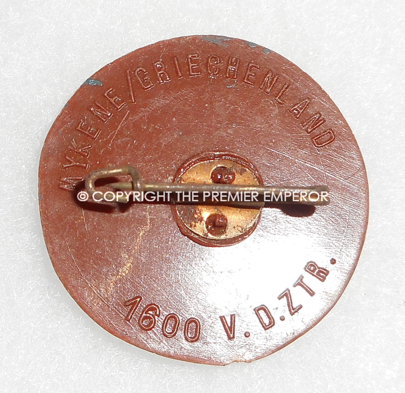 German Tinnie/Day badge. "Mykene/Griechenland plastic WHW Runic insignia. Circa.1930's/1940's.