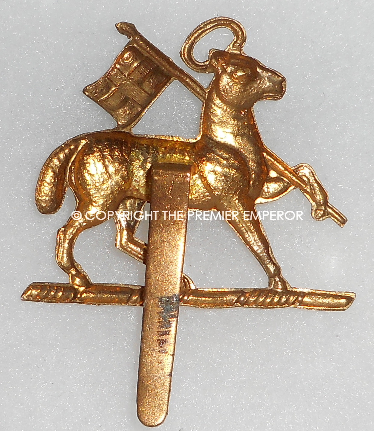 British. The Queen's Royal Regiment cap badge.Circa.Post 1924