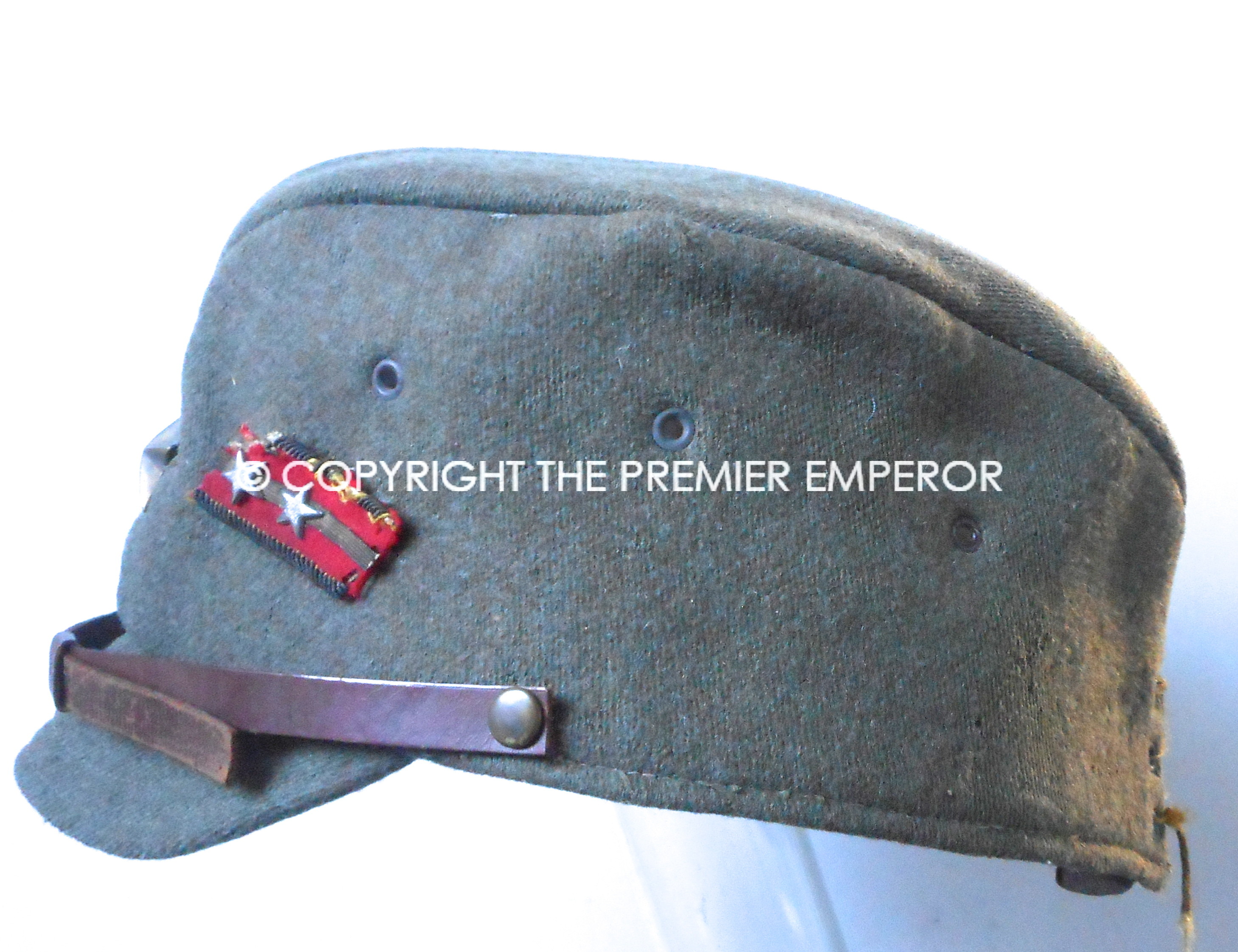Japan. World War Two Japanese Army Officer's cap with collar rank badge pinned to side.Circa.1941/45