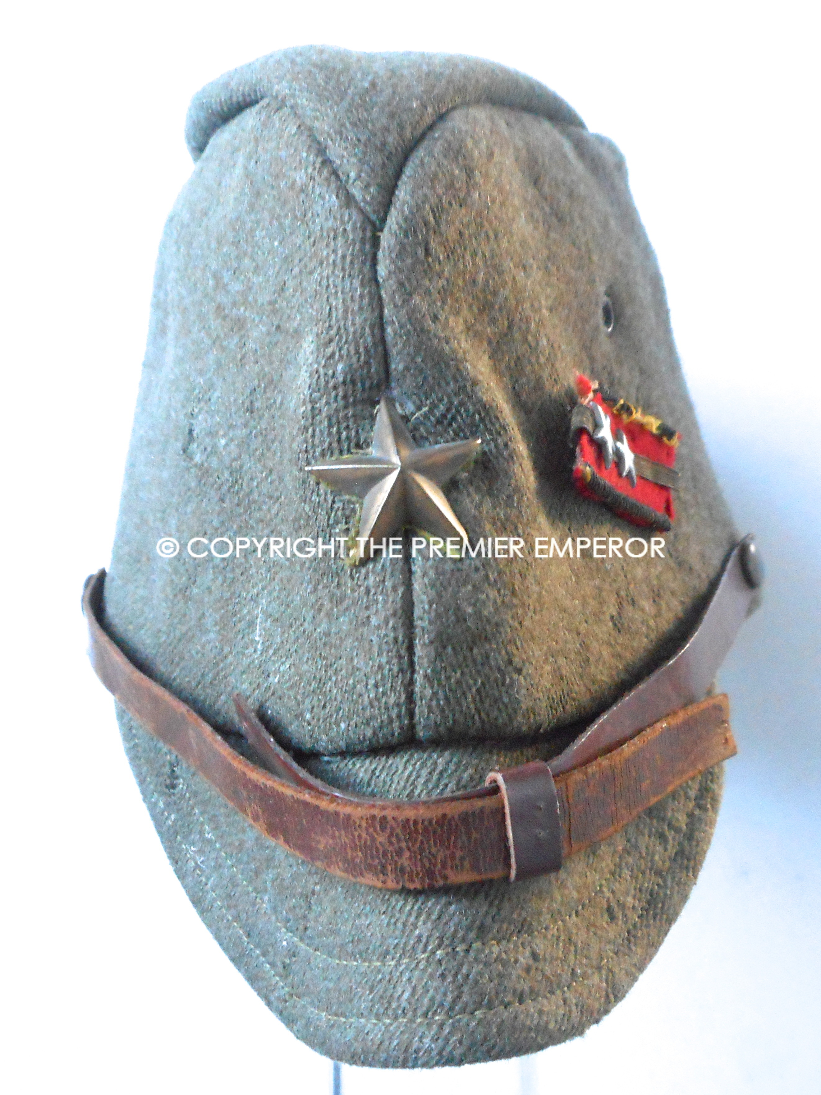 Japan. World War Two Japanese Army Officer's cap with collar rank badge pinned to side.Circa.1941/45